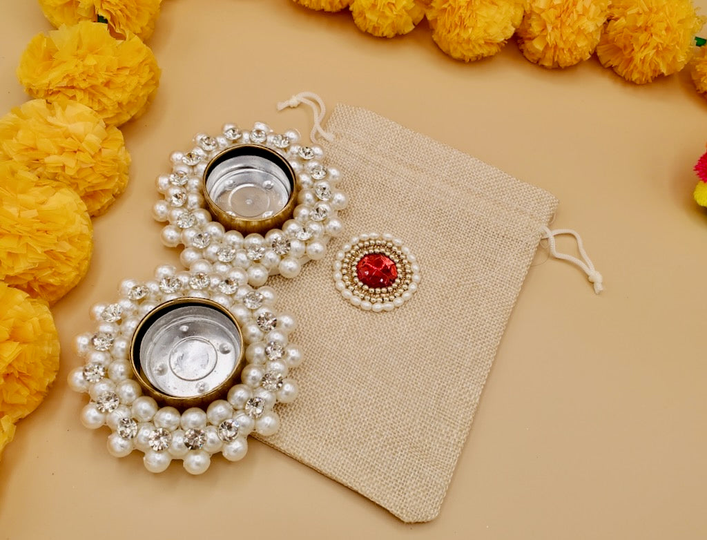 Set of 2 Pearl Diyas With Embellished Jute Potli