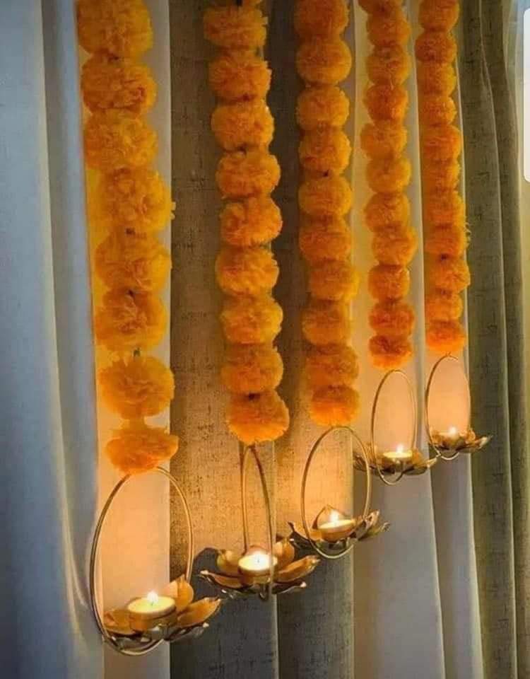 Metal lotus hanging in marigold