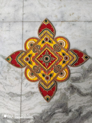 Red and yellow square rangoli